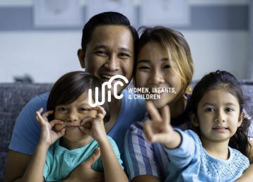 Portrait of mixed race Asian Parents with children